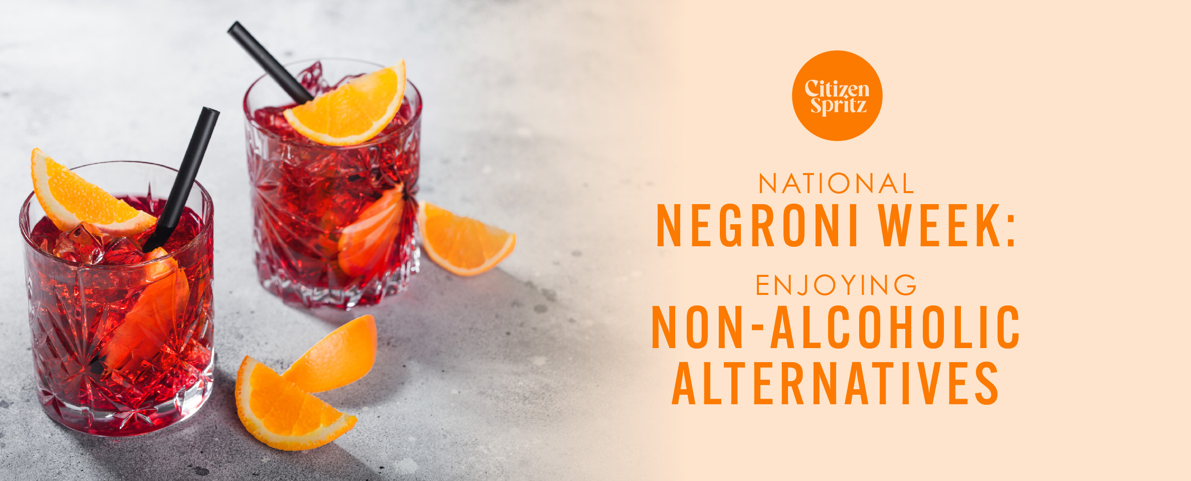 Two glasses of non-alcoholic Negroni garnished with orange slices and served with black straws, placed on a light grey surface. The text on the right side of the image reads 'Citizen Spritz - National Negroni Week: Enjoying Non-Alcoholic Alternatives' in orange and black letters.